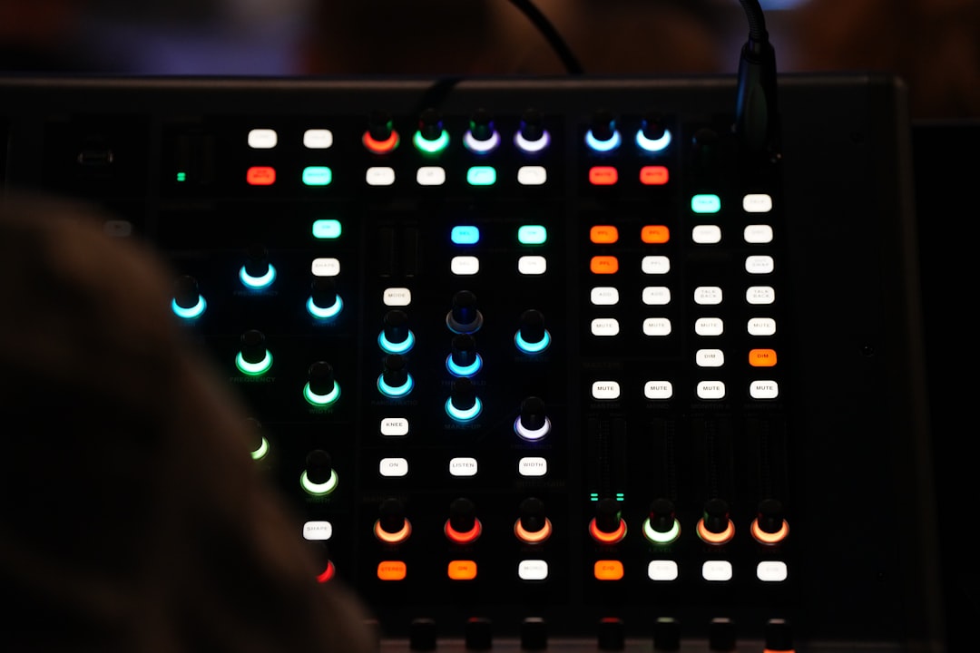 Sound mixer in the dark of a live performance.